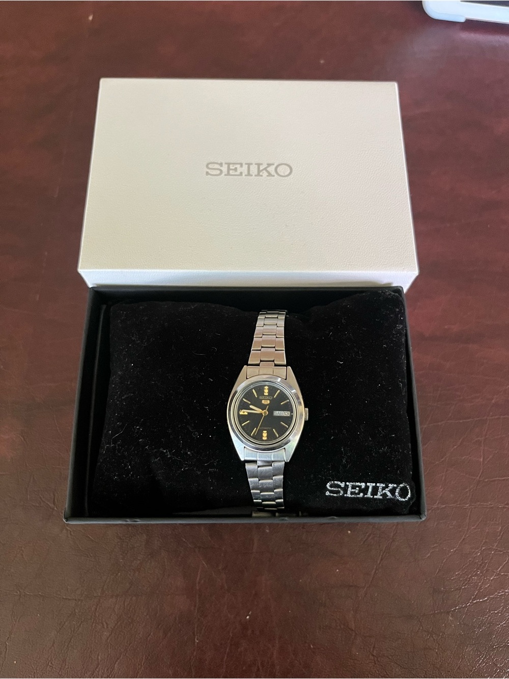 Seiko 5 Women's Silver Watch with Black Dial and Gold Accents